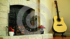 Light at a fireplace and a guitar in a corner