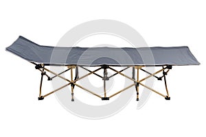 Light folding bed for camping and travel, with gray fabric, laid out and standing in a horizontal position