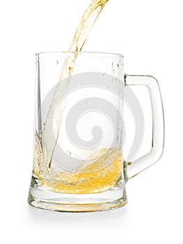 Light golden beer pouring into empty glass pint