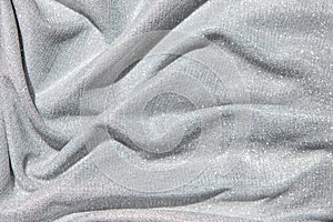 Light gray draped fabric with silver lurex thread