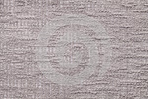 Light gray fluffy background of soft, fleecy cloth. Texture of plush furry textile, closeup.