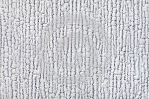 Light gray fluffy background of soft, fleecy cloth. Texture of textile closeup.