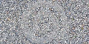 Light gray stone wall texture. Gray pebble dash panoramic background