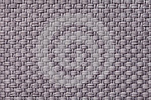 Light gray textile background with checkered pattern, closeup. Structure of the fabric macro.