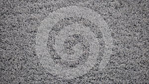 Light gray textile car carpet texture extreme close-up
