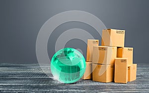 Light green globe and cardboard boxes. Economic relations commerce. Freight transportation. Distribution and trade exchange goods