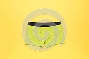 Light green men\'s underpants on a yellow background
