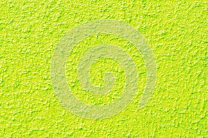 Light green, poisonously green wall texture background. Photo of light green textured