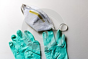Light green rubber gloves and protective mask on white background - Image