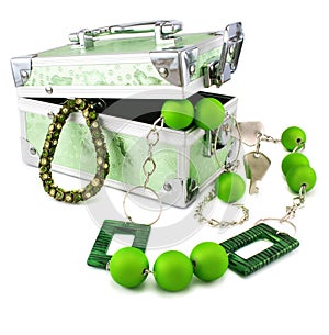 Light green trunk, beads and armlet isolated photo