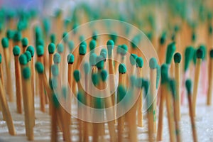 Light green wooden matches as illustration background of people standing in crowd concept. Group of objects background.