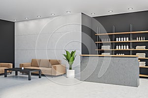 Light grey front desk with sofa in the corner