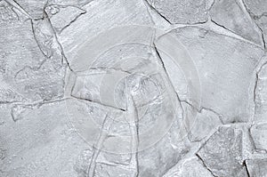 Light grey slate background or texture. White stone wall background