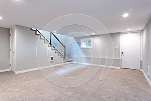 Light spacious basement area with staircase. photo