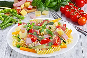 Light healthy colorful salad of italian pasta