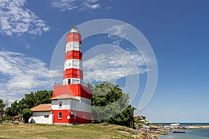 Light House on the sea shore in summer time with blue sky