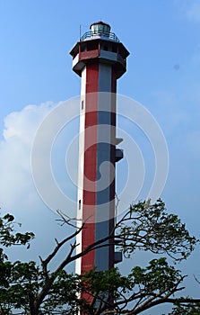 The light house with tree branches near manora fort.