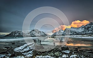 Light hunters on the Skagsanden beach in Lofoten, trying to catch a vanishing sunset.