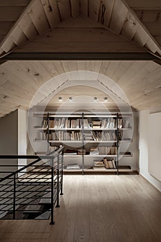 Light illuminated interior with sloping wooden ceiling