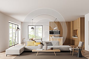 Light kitchen interior with couch and eating area, panoramic window