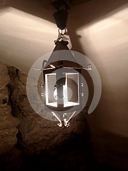 light from the lamp on the ceiling and the shadows in the mysterious corridor in the old dungeon of the castle
