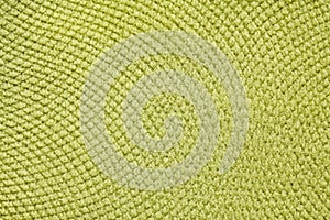 Light lime-green textile background.