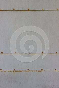 Light metal rusty wall with rivet background