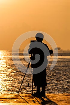 Light morning shadow of a man at sea.