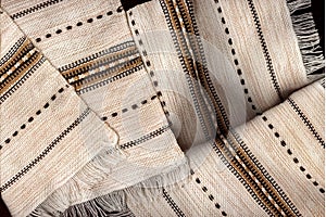 Light napkins made of natural fabric with a pattern and fringe