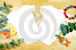 Light natural theme baby apparel top view flat lay. Mock up