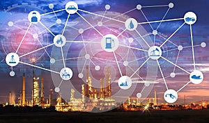 Light oil refinery at twilight with physical system icons diagram on industrial factory. Industry on technology 4.0 concept