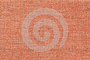 Light orange background of dense woven bagging fabric, closeup. Structure of the textile macro.