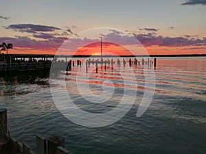 Light orange beautiful sunset view and paradise town orange sun over and gray clouds sky