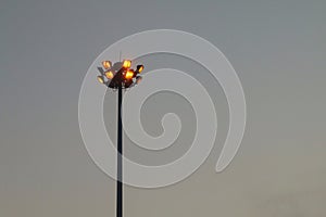 Light orange pole big on the highway, superhighway lighting column at night.