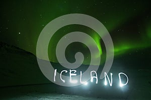 Light painting Iceland letters name written in Aurora Borealis polar northern lights night sky Northern Iceland Europe