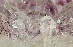 Light pale colored Amethyst quartz crystals in raw mineral form.
