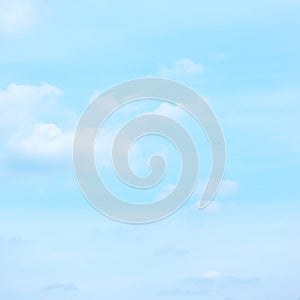 Light pastel blue sky small clouds