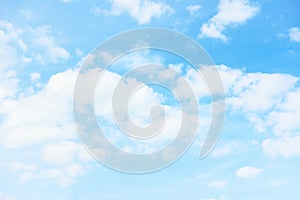 Light pastel blue sky with white clouds photo