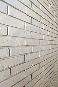 Light pastel brick wall in perspective for vertical background