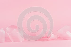 Light pink background with tender ribbon.