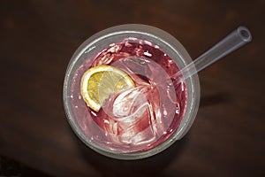 Light pink cocktail drink with lemon silice photo