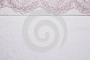 Light pink fabric texture with patterns.