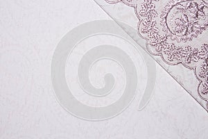 Light pink fabric texture with patterns.