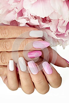 Light pink, pastel manicure on various shapes of nails