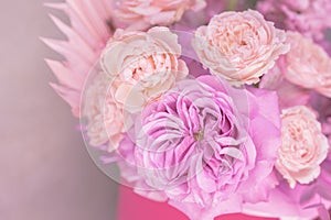 Light pink, purple, peach colour, white cute delicate small roses of different sizes, flowers in a lush bouquet