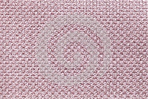 Light pink textile background with checkered pattern, closeup. Structure of the fabric macro.