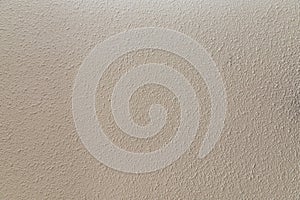 Light plaster wall texture background closeup