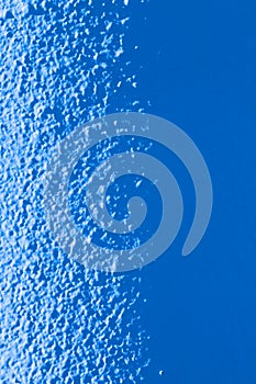 Light plastered wall for background. Light from left side. Close