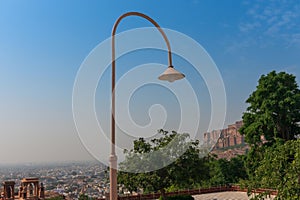 Light pole at beautiful decorated garden of Jaswant Thada cenotaph. Garden has carved gazebos, a tiered garden, and a small lake