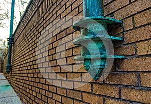 Light pole on the side of a wall in Asheville, North Carolina, U